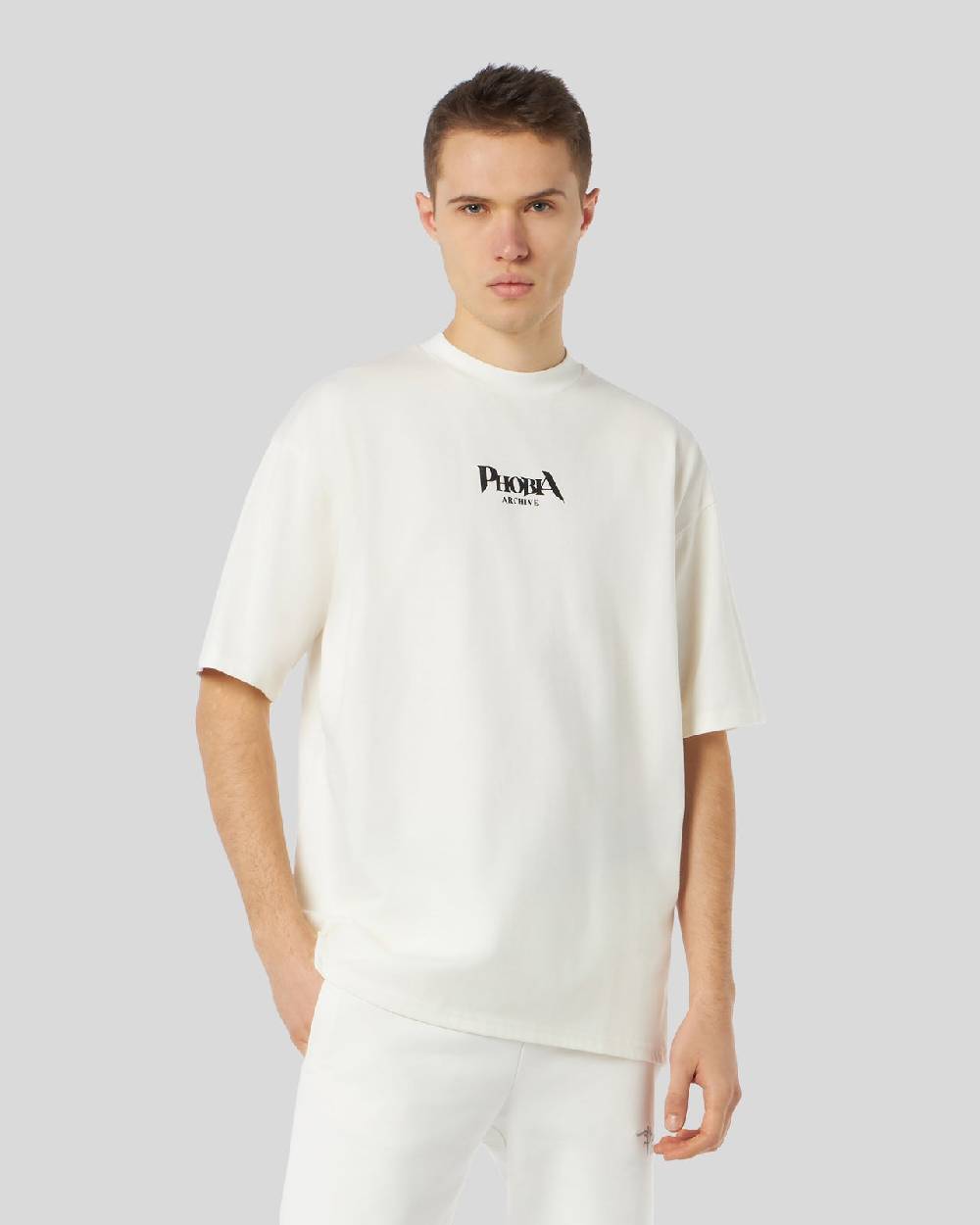 Phobia Archive T-SHIRT BIANCA CON GRAFICA BAT EYE VIOLA Vendita Calda