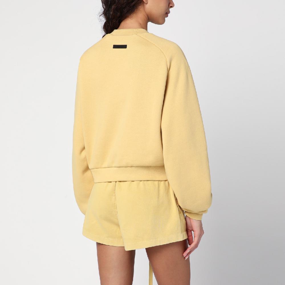 Fear of God Essentials Felpa cropped ambra con logo I Più Venduti