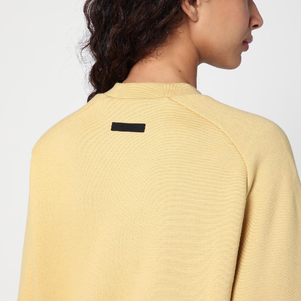 Fear of God Essentials Felpa cropped ambra con logo I Più Venduti